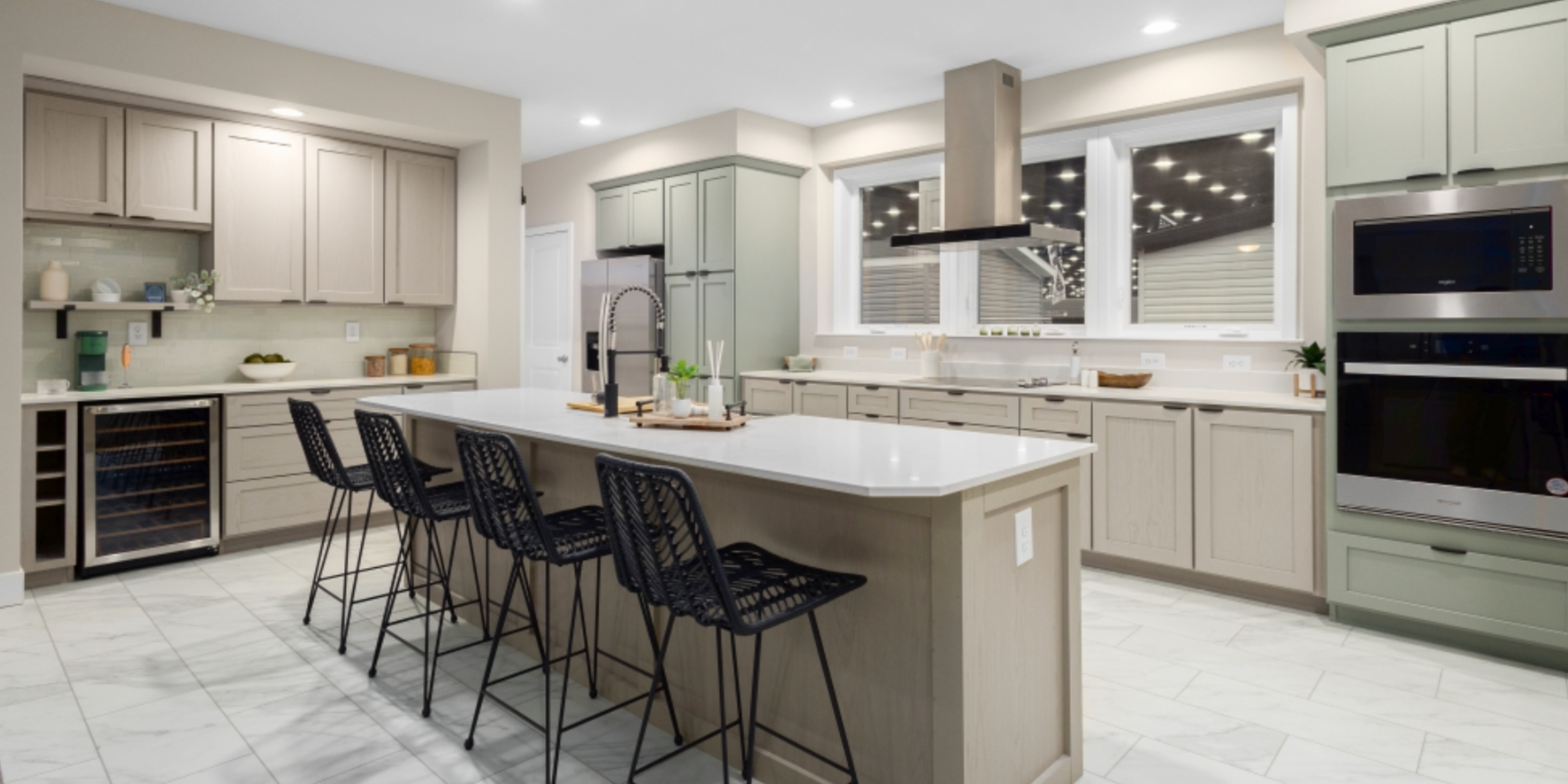 Bright modern kitchen with a large island and gray cabinetry